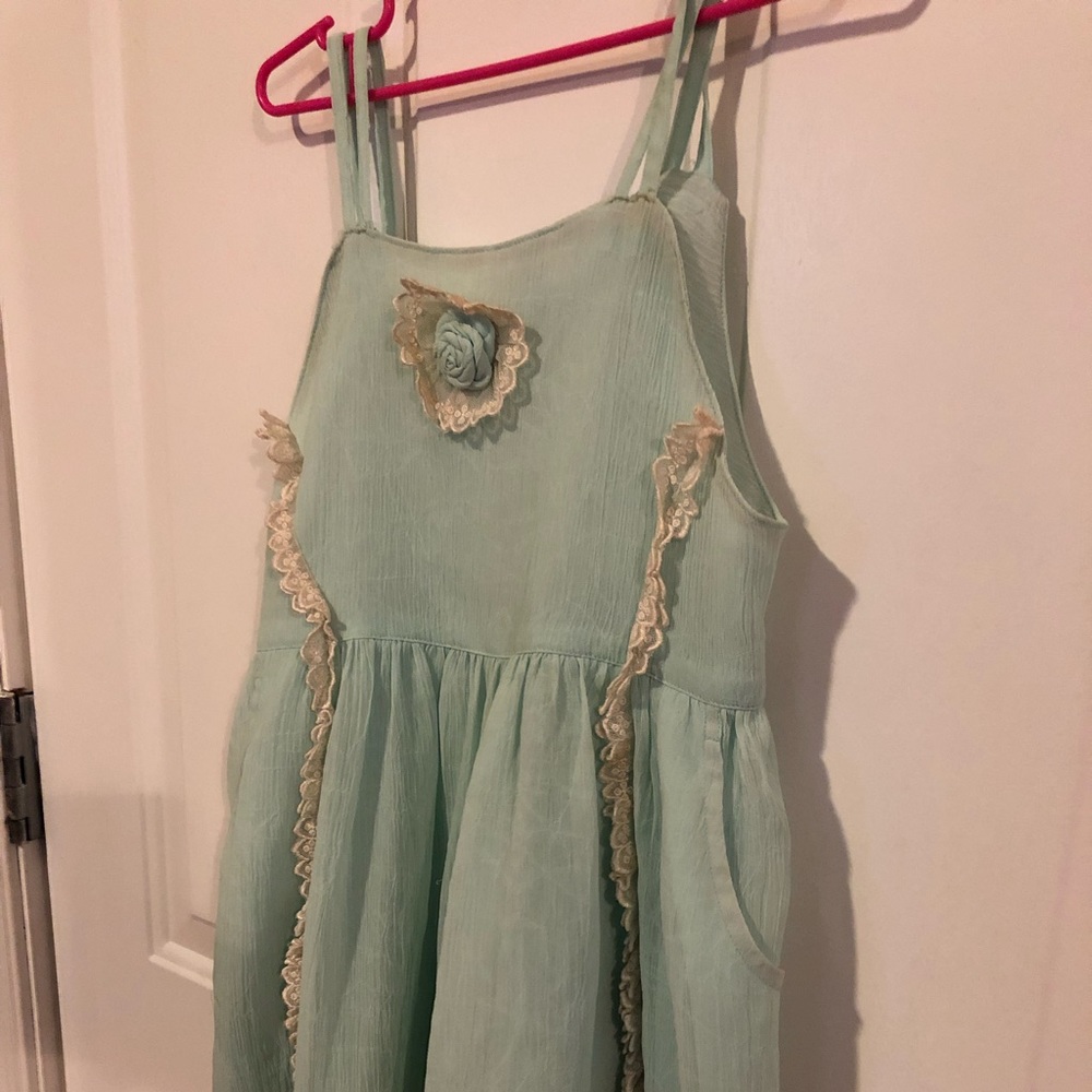 Light aqua chiffon like lined girls dress.